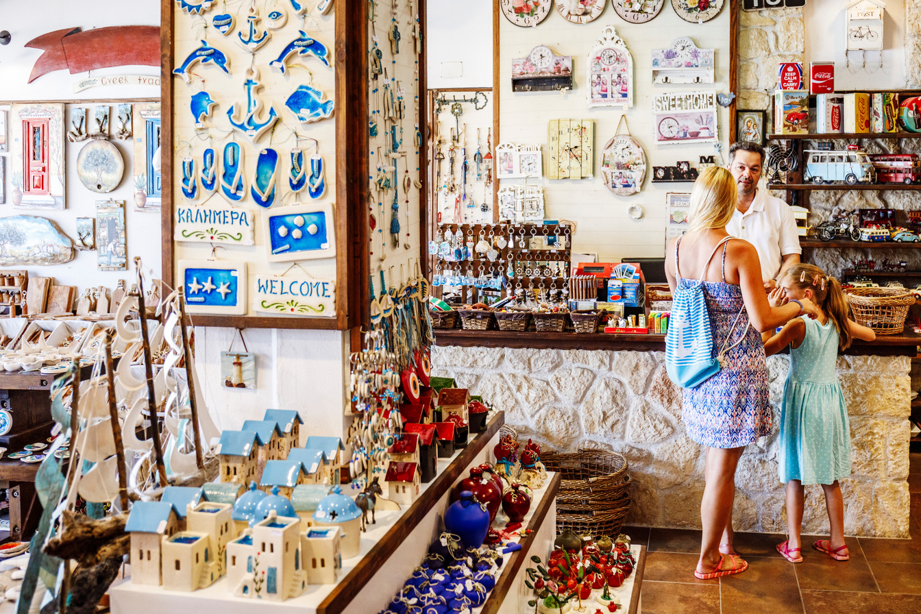 Buying souvenirs in Greek gift shop on vacation